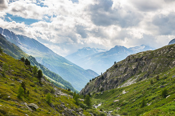 Fototapeta na wymiar Dramatic sky in alpine valley