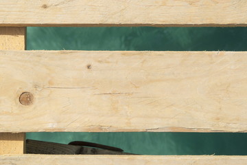 Wooden boards above sea water