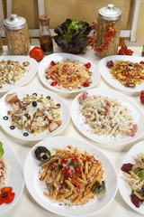 Variety of prepared pasta served on the table.