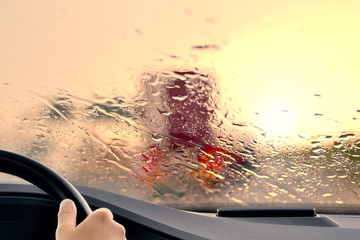 Driving on a Hiighway at Sunset when it starts to Rain