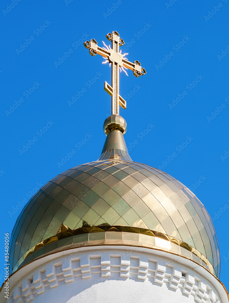 Canvas Prints Golden dome of Russian orthodox church with cross against blue s