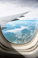 Naklejka na ściany i meble view from jet plane window on land