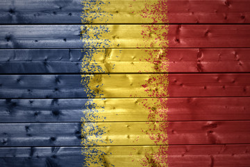 painted chad flag on a wooden texture