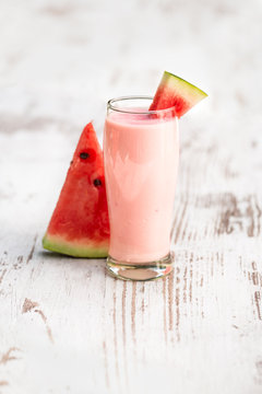watermelon smoothie on a wooden table