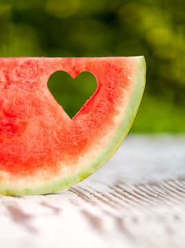 slice watermelon with a hole in the shape of heart