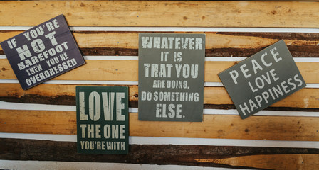 Signs with motivation words on rustic wood