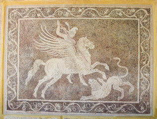 Mozaic of a horseman fighting a lion in Rhodes, Greece