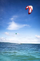 Kiteboarder on surfing on sea