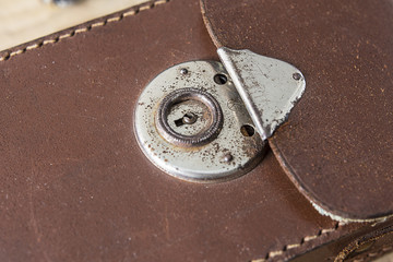 Old leather bag with rusty lock