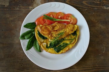 Omelet with potatoes and spinach
