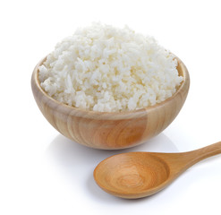 rice in wood bowl on white background
