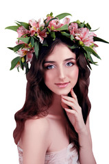 Young woman wearing pink flowers on her head isolated on white