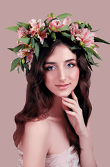 Young woman wearing pink flowers on her head 