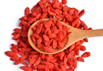 dry red goji berries  in the spoon on white background