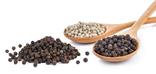 peppercorn in the wooden spoon on white background