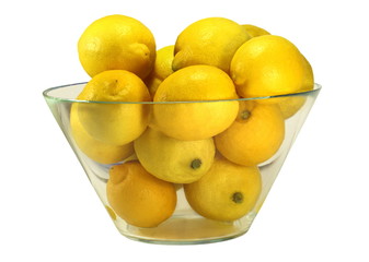 Bowl of Lemons – Glass bowl filled with juice yellow lemons 