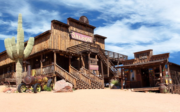 Old Wild West desert cowboy town with cactus and saloon