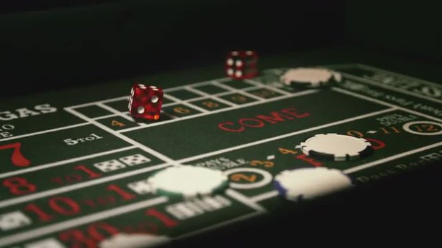 Throwing Dice on Craps Game. Shoot on Digital Cinema Camera in 4K  slow motion - ProRes 422 HQ codec.