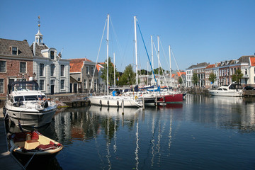 Fototapeta na wymiar Sailboats at the dock. Dutch landscape.