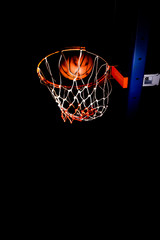 Obraz premium Basketball hood in the dark with light effect