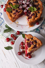 Sliced homemade cake with cherries closeup. vertical top view
