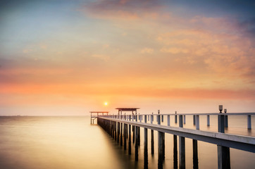 Landscape of Wooded bridge in the port between sunrise.