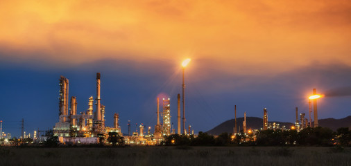 Obraz na płótnie Canvas Big Industrial oil tanks in a refinery with treatment pond at industrial plants.