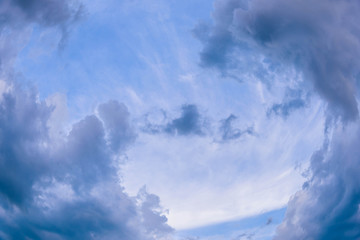 Obraz premium Rain clouds are gathering evening light from the sun as well.