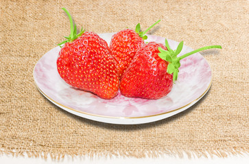 Saucer with strawberries