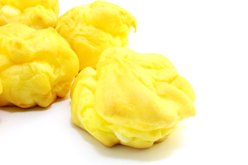 close up of cream puffs isolated on white background