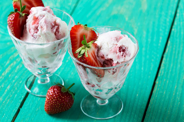 Strawberry ice cream with fresh strawberries, cold summer desser
