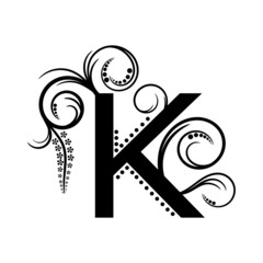 Black alphabet letter K with creeping plant