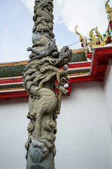 Dragon pillars located in Wat Pho. Bangkok in Thailand,