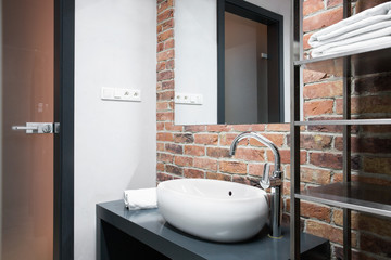 Bathroom with brick wall
