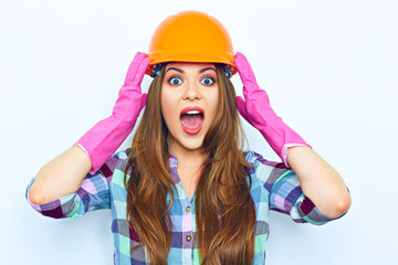 Emotional woman worker wearing pink glow, building helmet.