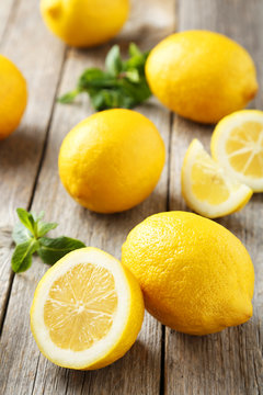 Lemons on grey wooden background