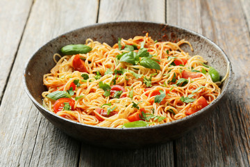 Spaghetti with tomatoes and basil