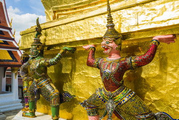 Perspective view of demon guardians supporting Wat Arun Temple, Bangkok, Thailand
