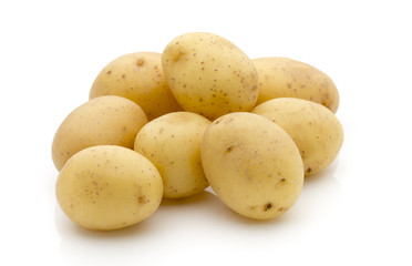 Potatoes on the white background.  New harvest.