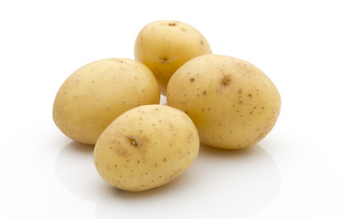 Potatoes on the white background.  New harvest.