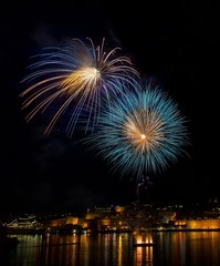Blue fireworks in dark sky background on 4 of July