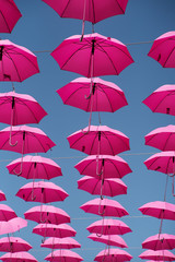Obraz premium Many decorative pink umbrellas