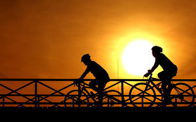 Fototapeta na wymiar silhouette of a cyclist at sunset