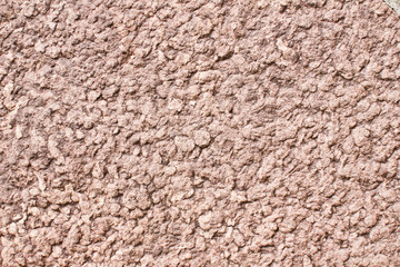 Red grunge rock rough texture.