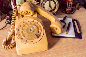 Phone on wooden desk.
