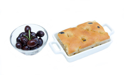 Focaccia with black olives on white background