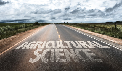 Naklejka premium Agricultural Science written on rural road