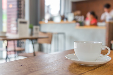 Coffee cup on table in cafe