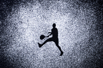 sport concept, shape of man in action by powder. Part of a tenni