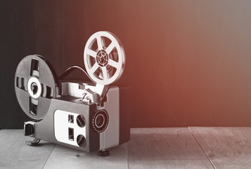 old 8mm Film Projector over wooden table